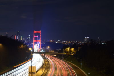High angle view of light trails on road at night