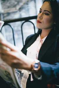 Close-up of woman working in bus