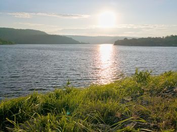 Scenic view of lake against sky during sunset