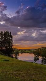 Scenic view of lake against cloudy sky