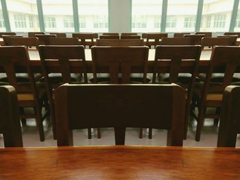 Empty chairs and tables on hardwood floor