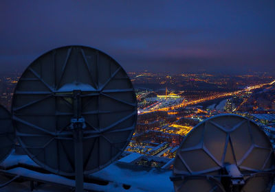 Illuminated cityscape against sky