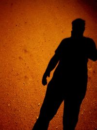 Silhouette of man shadow on ground