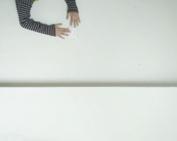 Low section of woman on tiled floor