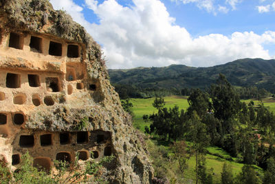 View of old ruins against cloudy sky