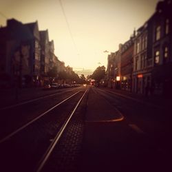 Road in city at sunset