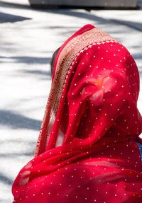 Rear view of woman in red sari