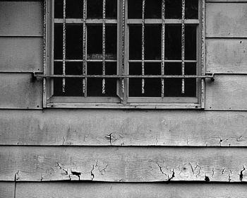 Window on old abandoned cottage