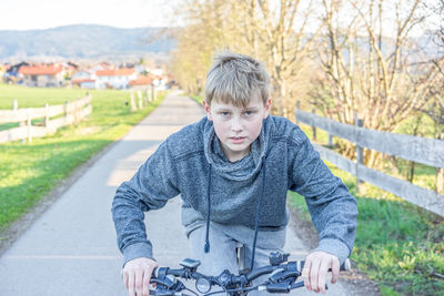 Portrait of boy smiling bicycle