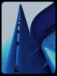 Low angle view of tree against blue sky