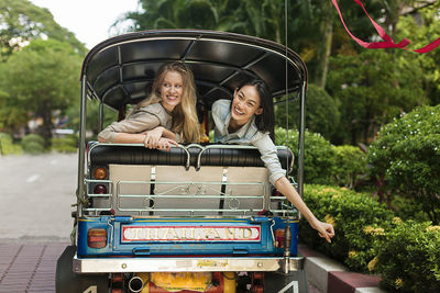 Young women on rickshaw, bangkok, thailand