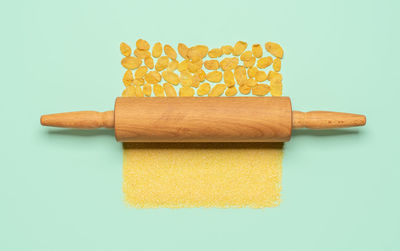 Directly above shot of yellow bread against white background