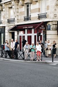 People walking on street in city