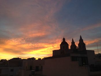 High section of building at sunset