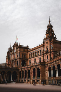 Facade of historic building against sky