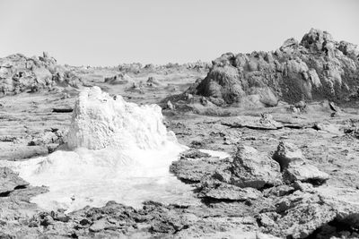 Scenic view of rocks against clear sky