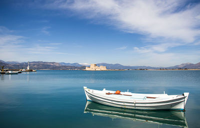 Boats in sea against sky