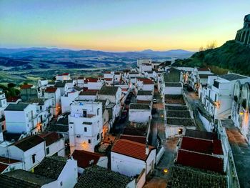 High angle view of houses in city against sky