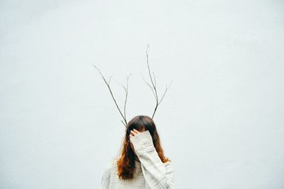 Close-up of woman over white background