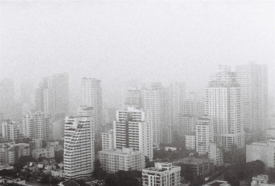 Aerial view of cityscape against sky