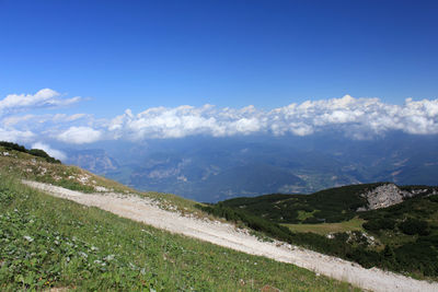 Scenic view of landscape against blue sky