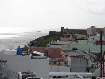 View of sea with buildings in background