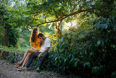 Woman sitting in a forest