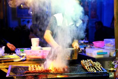 Blurred motion of person preparing food