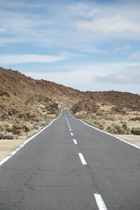 Empty road passing through landscape