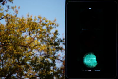 Low angle view of illuminated road against sky