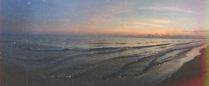 Scenic view of sea against sky at sunset