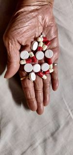 Close-up of person holding pills