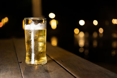 Close-up of beer glass on table