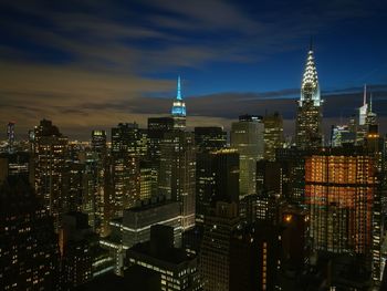 Aerial view of city lit up at night