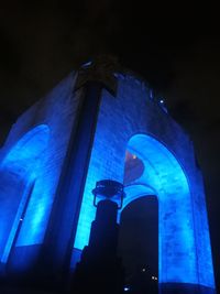 Low angle view of illuminated building at night