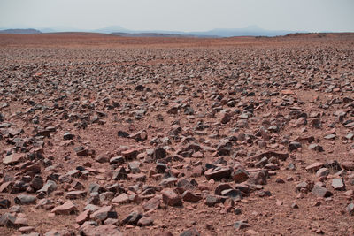 Scenic view of desert land against sky