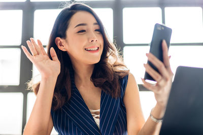 Young woman using mobile phone