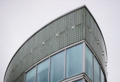 Low angle view of modern building against clear sky