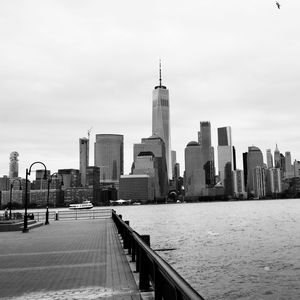 View of skyscrapers against cloudy sky