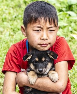 Portrait of boy with dog