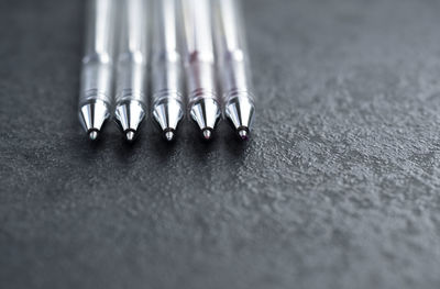 Close-up of pens on table