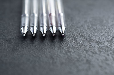 Close-up of pens on table