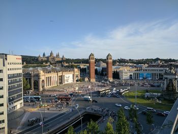 High angle view of city street and buildings against sky