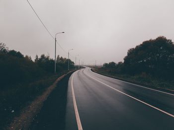 Empty road against sky