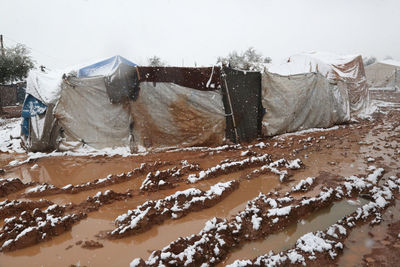 Syrian refugee tents covered with heavy snow.