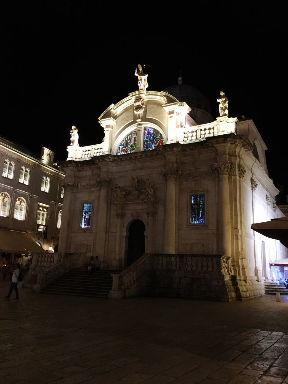 LOW ANGLE VIEW OF BUILDING AT NIGHT