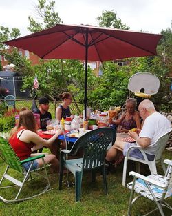 People relaxing at restaurant table