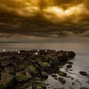 Scenic view of sea against sky at sunset