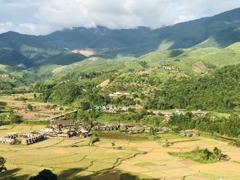 High angle view of trees and mountains against sky