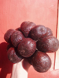 High angle view of strawberries on table against wall